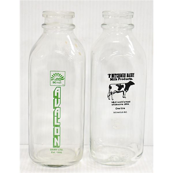 2 X MILK BOTTLES WITH WRITING AND LOGOS B.C.