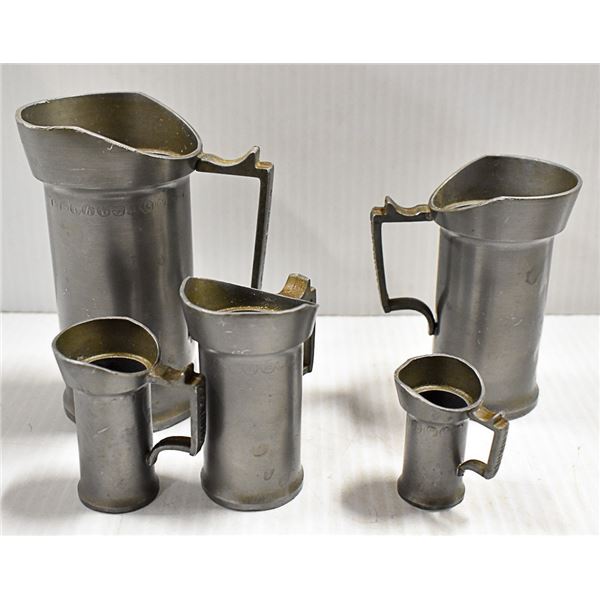 BOX OF FIVE PEWTER MEASURING STEINS FROM HOLLAND