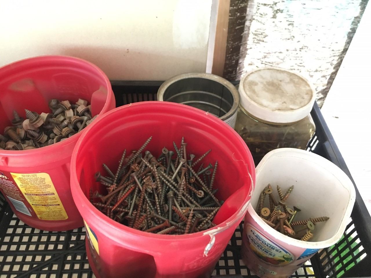 Containers filled with Nails and Screws