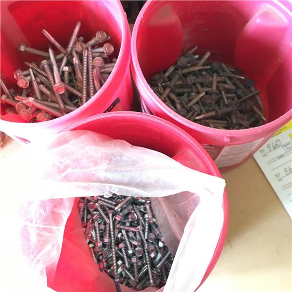 Coffee containers filled with screws and bolts.