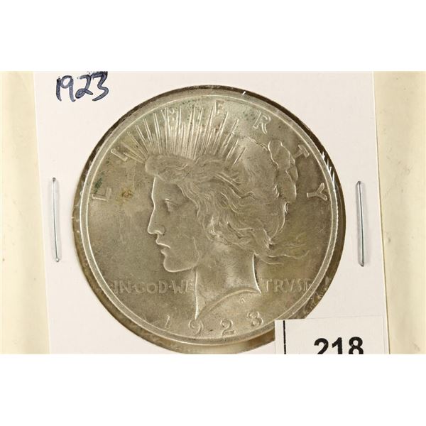 1923 PEACE SILVER DOLLAR COUPLE SPOTS ON OBV. AU+