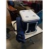 Image 1 : ROLLING COLEMAN COOLER WITH LANTERN, STOVE, PERCOLATOR AND FOLDING CAMP CHAIR