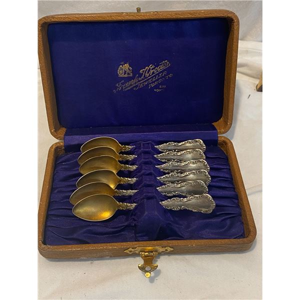 Sterling spoons in case