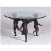 Image 1 : Beveled glass topped coffee table with a trio of spelter prancing putti