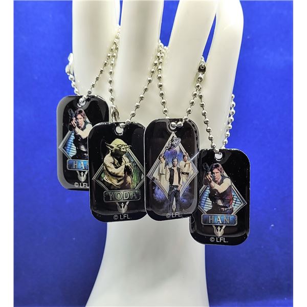 3)  LOT OF 4 STAR WARS DOG TAGS/KEY CHAINS