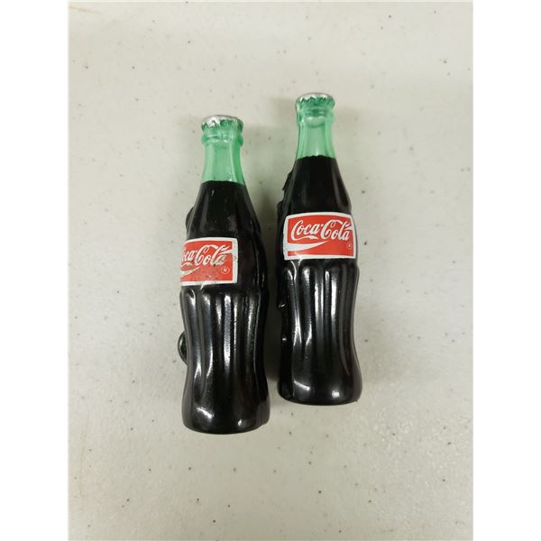 TWO SMALL PLASTIC COCA COLA BOTTLES