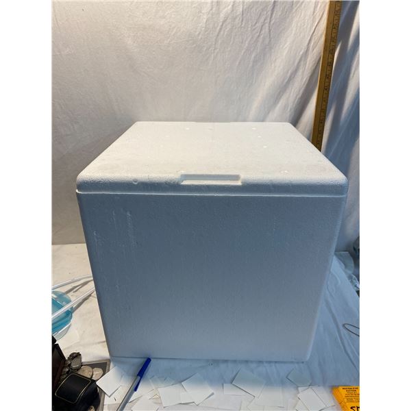 Styrofoam cooler, knapkins and some paper plates