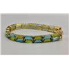 Image 10 : 14k Gold Topaz and Peridot Tennis Bracelet