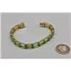 Image 3 : 14k Gold Topaz and Peridot Tennis Bracelet