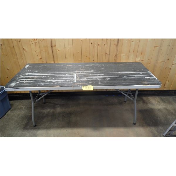 PLASTIC TABLE WITH FOLD OUT LEGS RUBBER MAT GLUED TO TOP