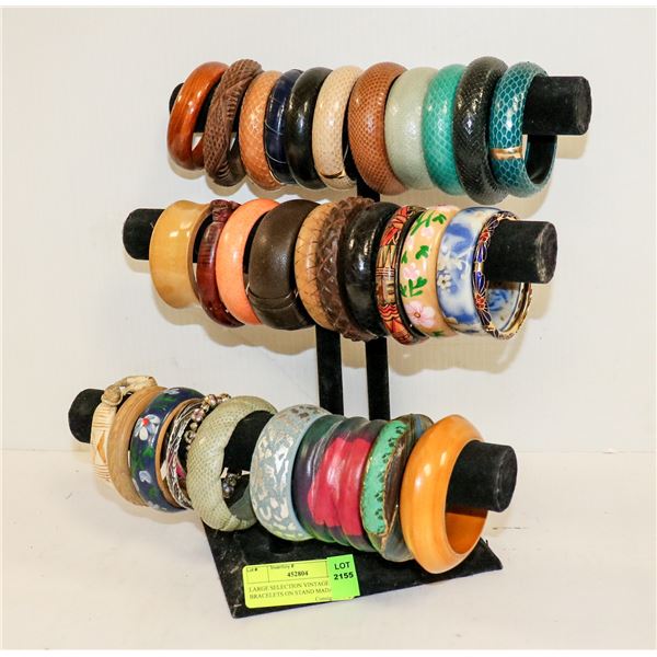 LARGE SELECTION VINTAGE BRACELETS ON STAND MADAME