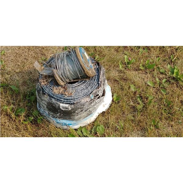 NEW ROLL OF BARBED WIRE, PARTIAL ROLL OF ELECTRIC FENCE WIRE