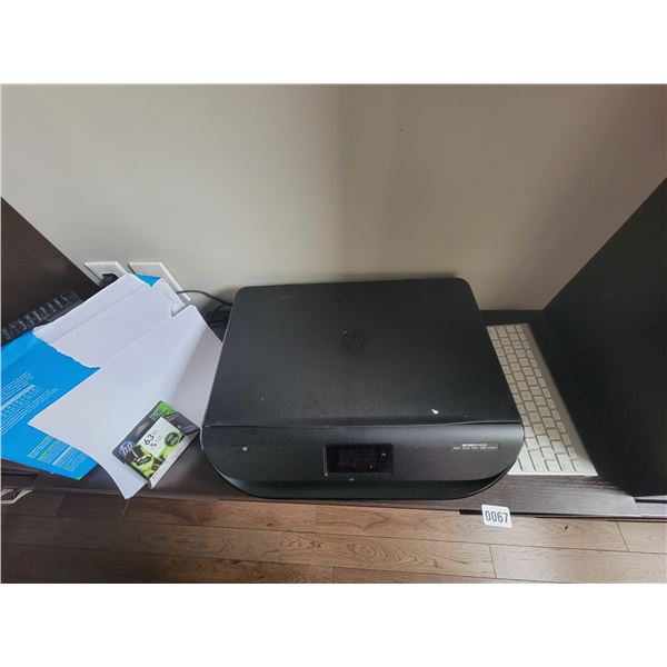 Apple keyboard and HP Printer with paper and ink cartridge