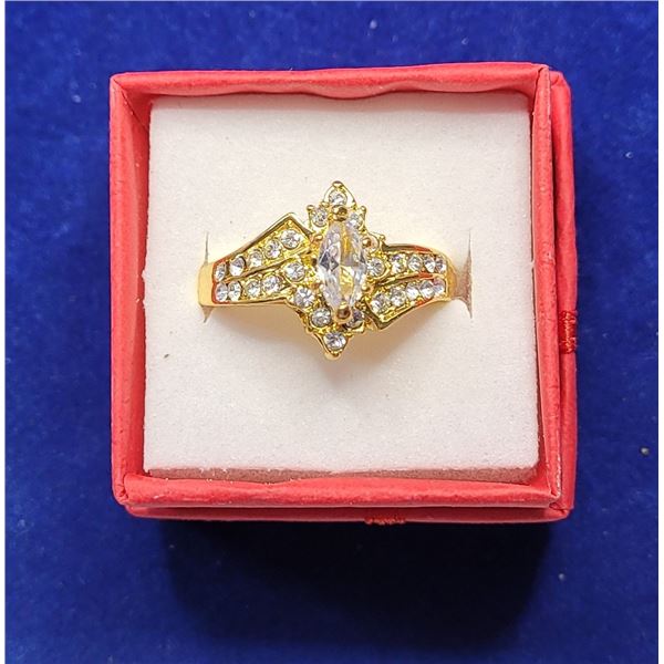 13)  GOLD TONE AND CLEAR CZ RING,  SIZE 9.