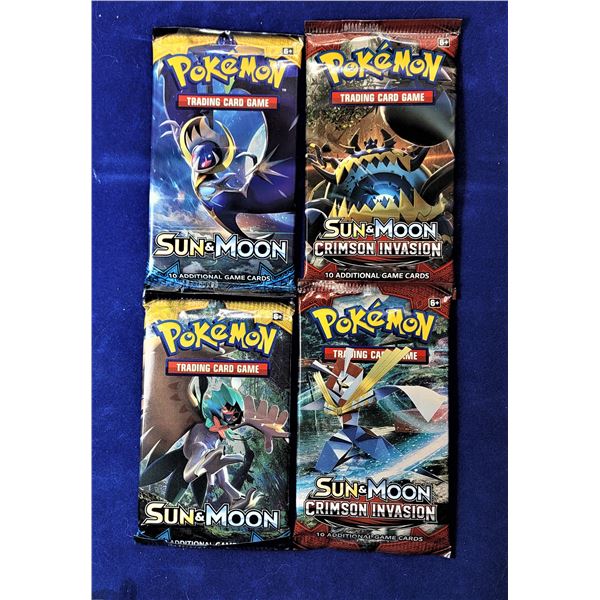 22)  LOT OF 4 SEALED PACKAGES OF POKEMON