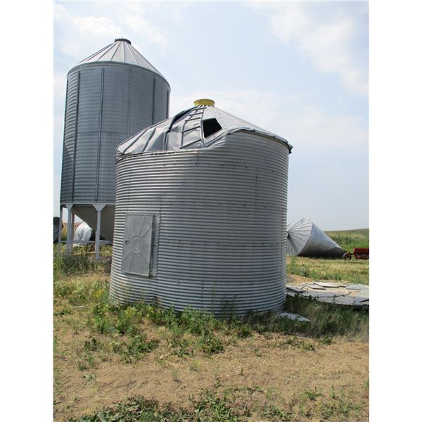 Damaged flat bottom grain bin