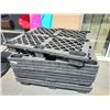 Image 1 : Stack of black 4 way pallets, nesting type,