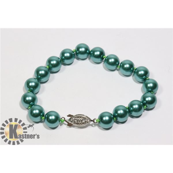 #130-SEA SHELL PEARL BRACELET 10mm/ 8 