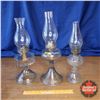 Image 1 : Trio of Oil Lamps (Clear Glass Bases) (19"H Tallest)