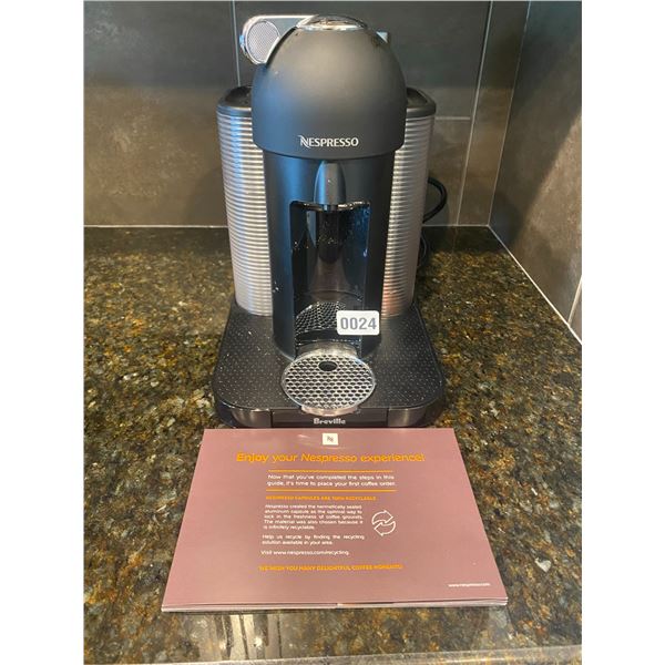Nespresso Coffee Machine with pods and cups.
