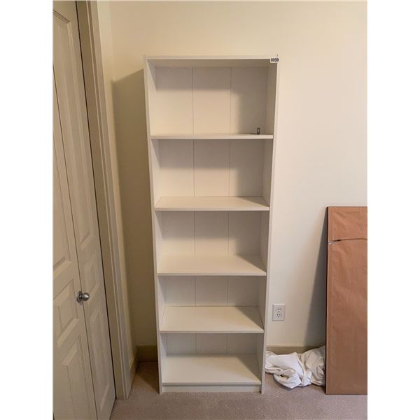 Shelving Unit with Various Books and Magazines