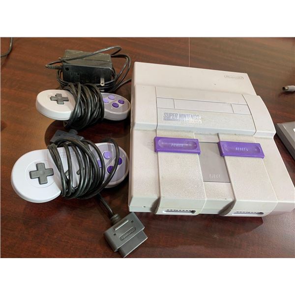 Super Nintendo Entertainment System with controllers and adapter