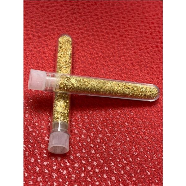 Two Large vials of golden flaking material