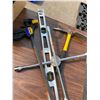 Image 2 : Bar clamp, level, tire iron and pick axe