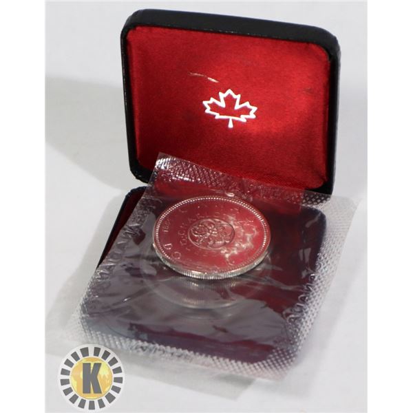 1964 CANADIAN SILVER DOLLAR STILL IN ORIG MINT BAG