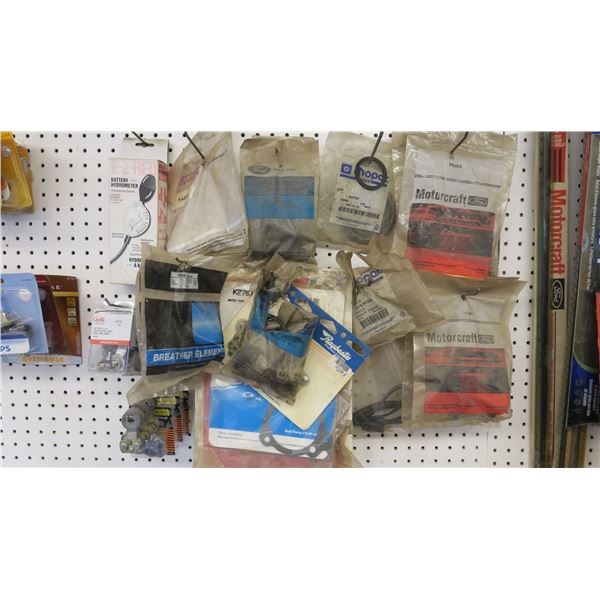 lot of auto parts (battery terminals, breathers, gaskets, brake line)