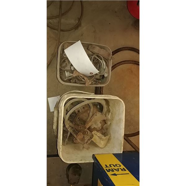 2 pails of assorted muffler clamps
