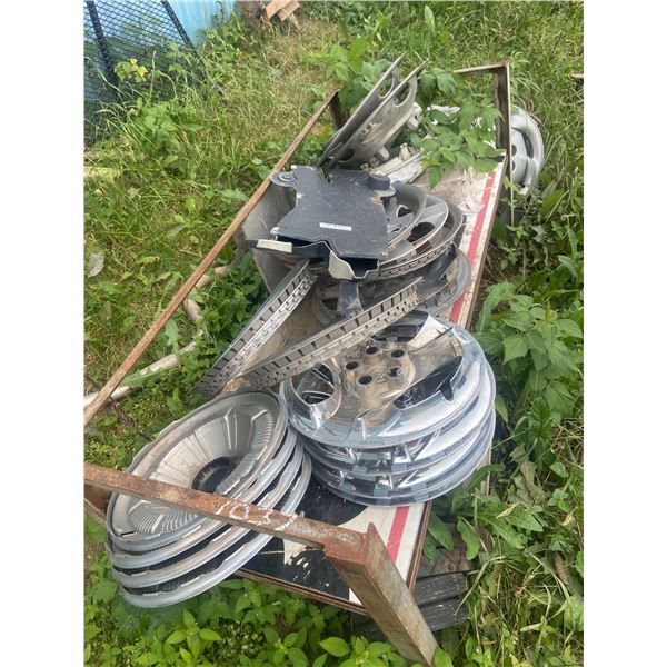 lot of misc hubcaps & metal rack