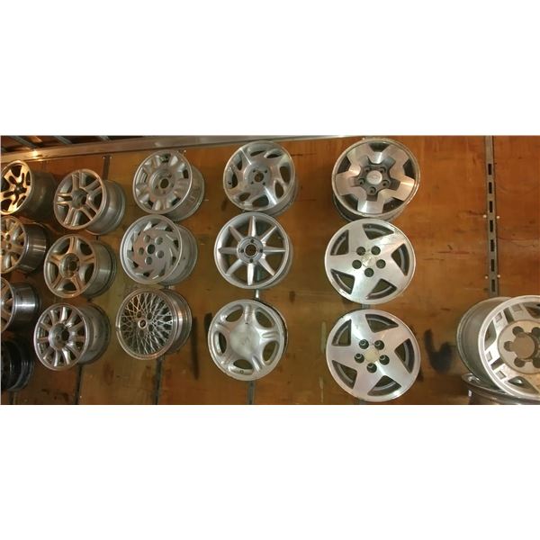 12 MISC RIMS (ON WALL)