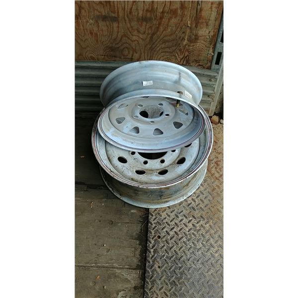 2 TRAILER RIMS, 5 BOLT AND 8 BOLT