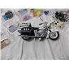 Image 5 : Plastic containers filled with misc, metro police toy motorbike, delisle hockey trophy