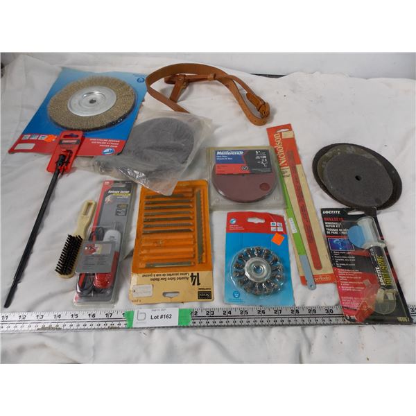 Voltage tester, sanding discs, wire brush discs + hack saw blades