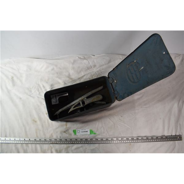International Harvester box with fishing items. 2 fish scales, pliers, fish scaler