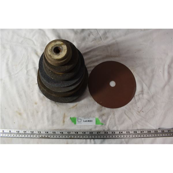 7 Grinding stones and 1 piece of sandpaper