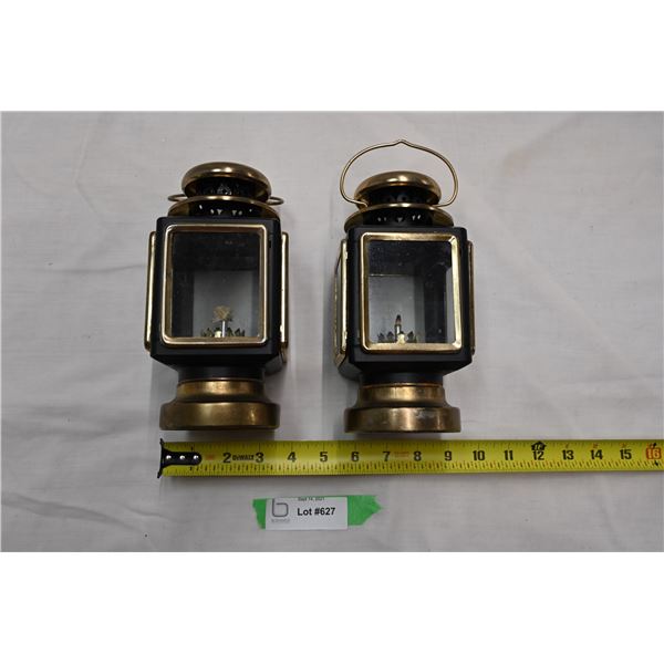 pair of small lightweight oil lamps