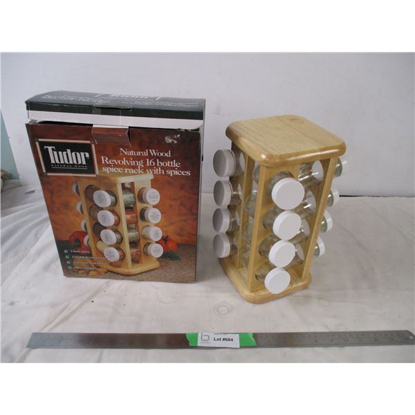 Wooden spice rack with empty glass spice bottles