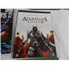 Image 4 : Inside the Sideshow studio + Lord of the Rings game book + Assassins Creed 2 play through guide + In