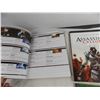 Image 7 : Inside the Sideshow studio + Lord of the Rings game book + Assassins Creed 2 play through guide + In