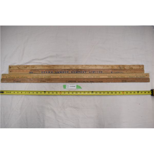 4 vintage yard sticks