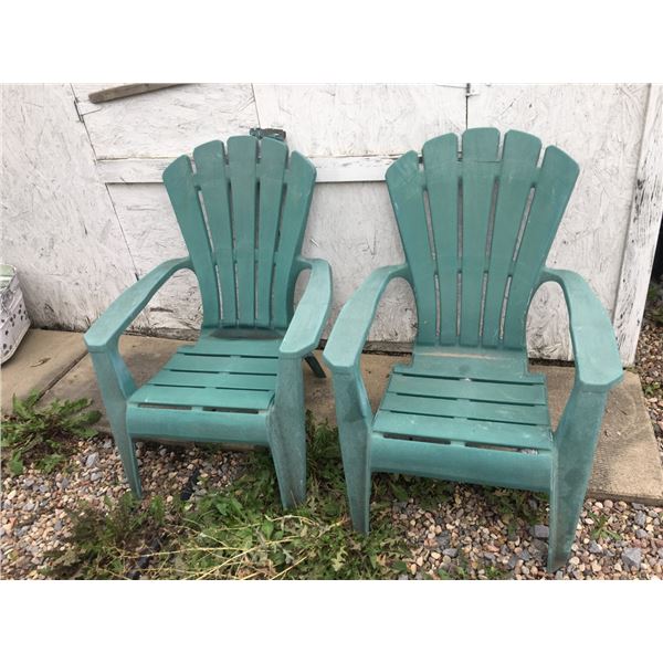 Two Green Plastic Adirondack Chairs