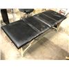 Image 1 : Black vinyl portable fold up massage table (small rip in the fabric)