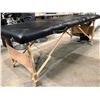 Image 3 : Black vinyl portable fold up massage table (small rip in the fabric)