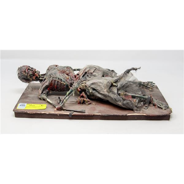 ARTIST PAINTED ZOMBIE STATUE RECLINING