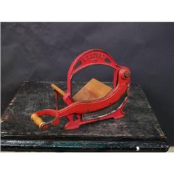 Antique Cast-Iron Slicer  Red in Color