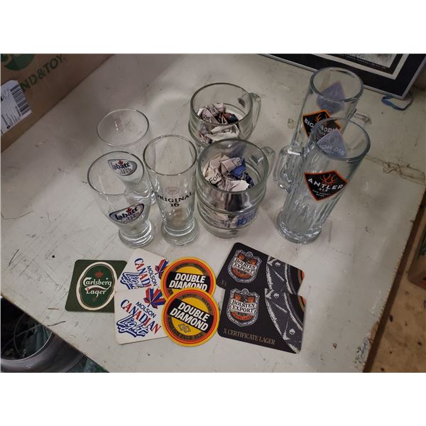 lot of beer mugs & coasters