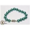 #130-SEA SHELL PEARL BRACELET 10mm/ 8"